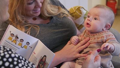 Close up photograph of baby with mum and granny